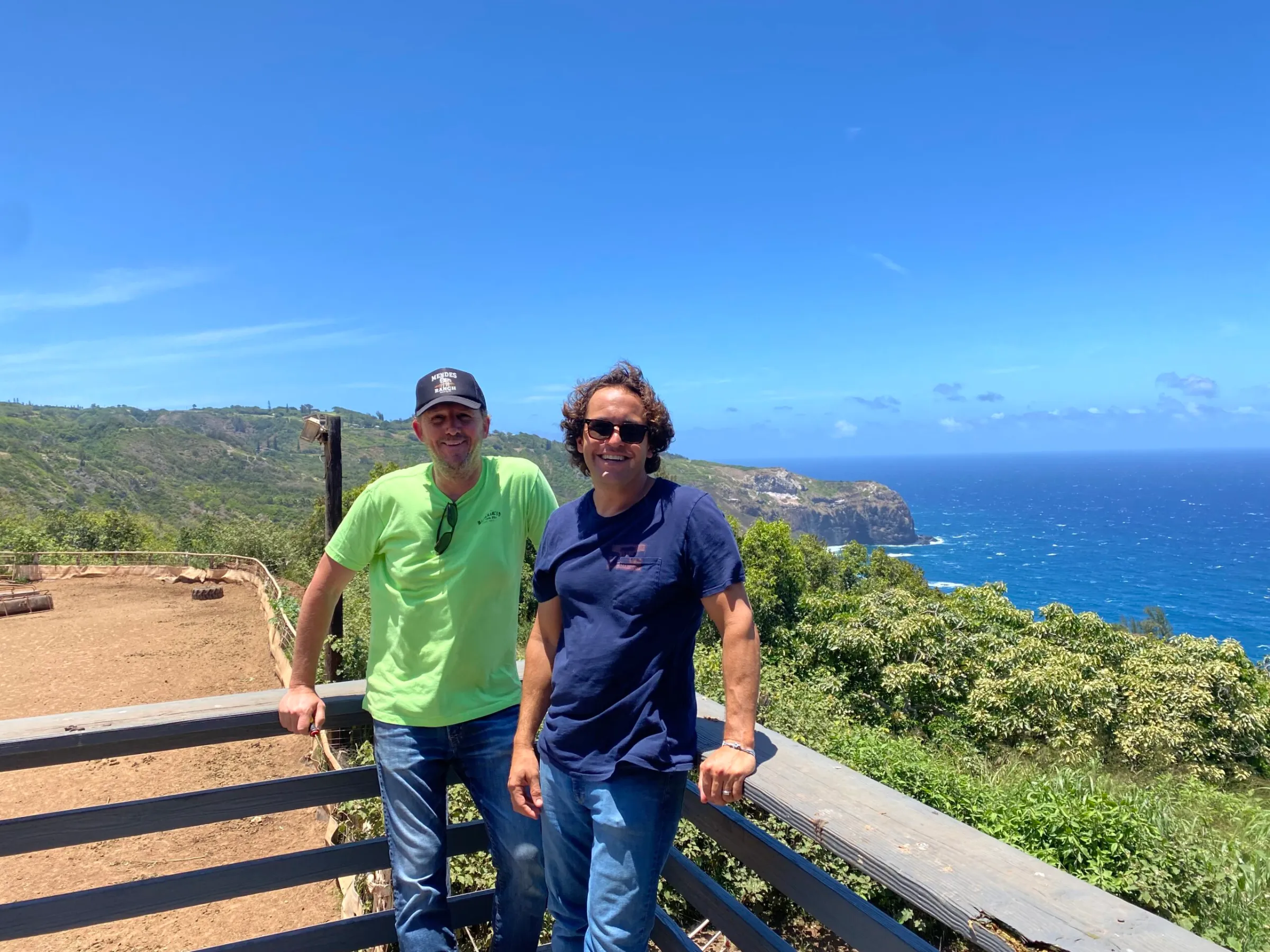 a man standing next to a mountain