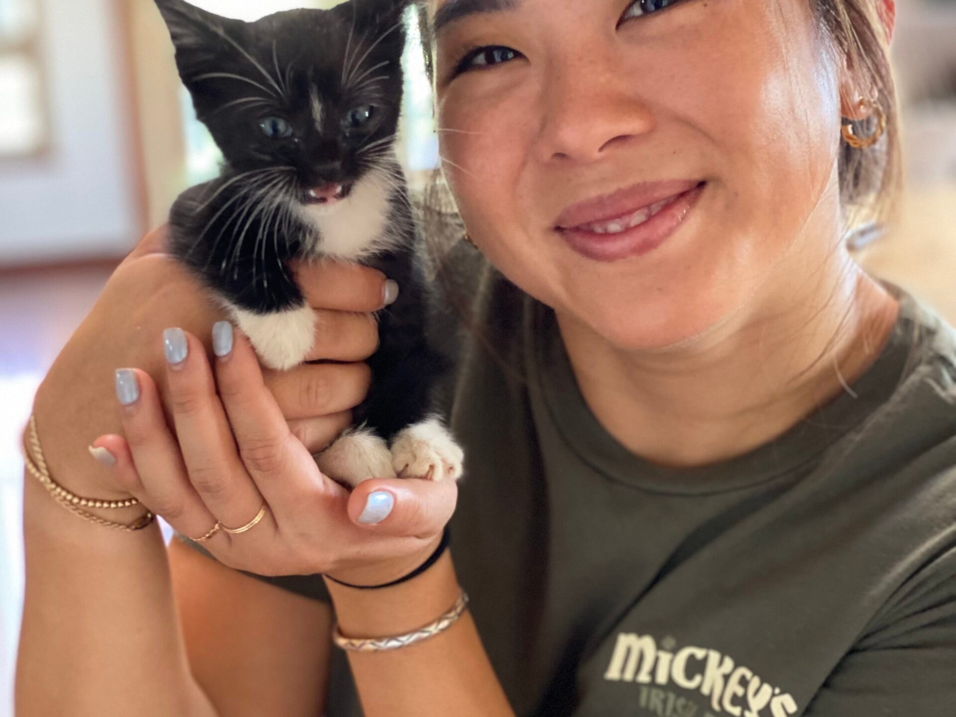 a woman holding a cat